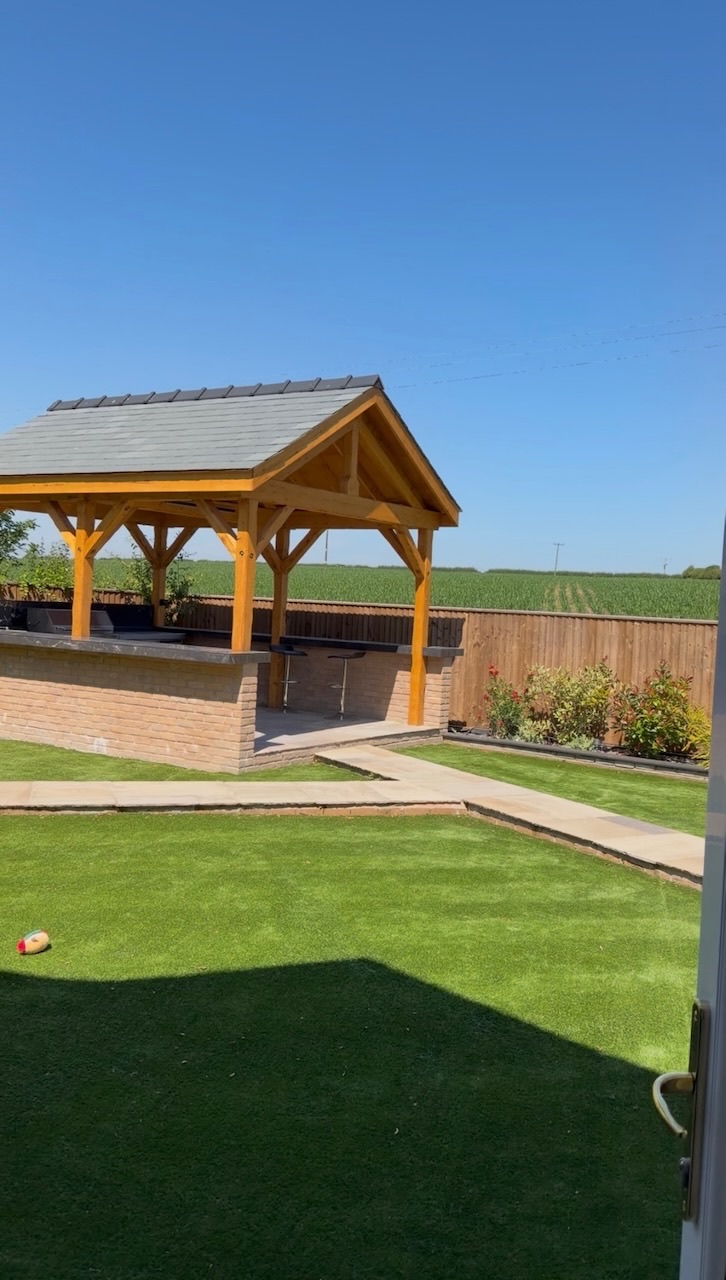 Outdoor oak-framed gazebo and bar area with artificial lawn, Westby, Lytham — Wilsons Systems
